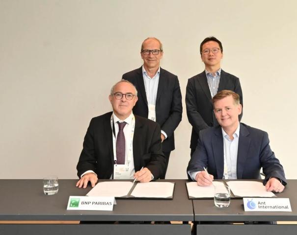 (Clockwise from top left) Marc Espagnon, Head of Payment and Cash Management at BNP Paribas, Kelvin Li, GM of Platform Technology at Ant International, Douglas Feagin, President of Ant International and Pierre Fersztand, Global Head of Cash Management, Payments, Trade Solutions & Factoring at BNP at the MOU signing ceremony on 3 July (Photo: Business Wire)
